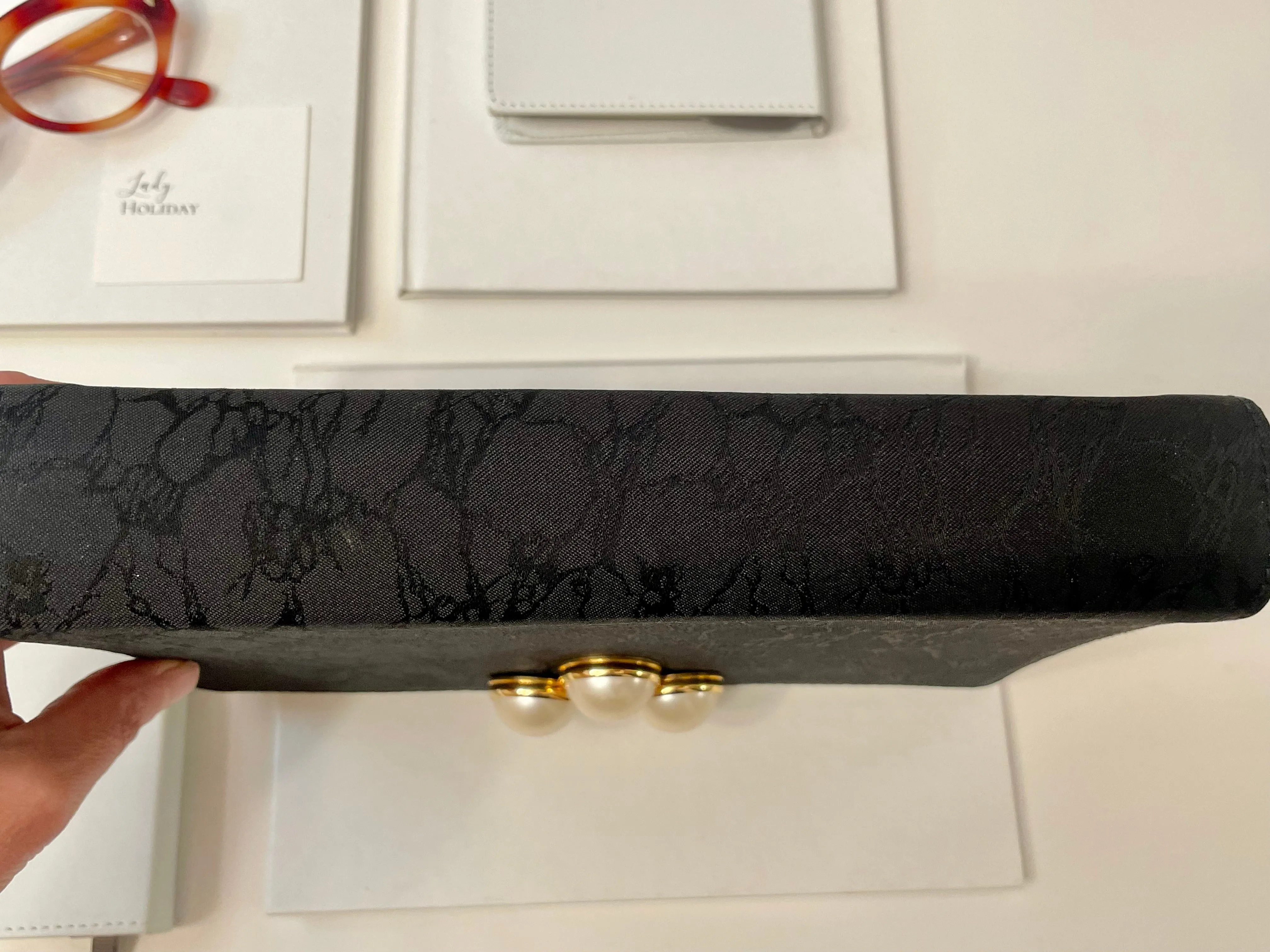 Isn't she charming delightful noir clutch bag, adorned with large pearls.... so elegant
